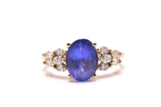 A tanzanite and diamond dress ring, featuring an oval tanzanite approximately measuring 9.8 x 7.5