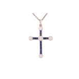 A diamond and sapphire cross pendant on platinum chain, featuring five round brilliant diamonds with