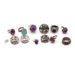 A mixed lot of various rings, six of them set with amethyst cabochons, and a set of silver floral