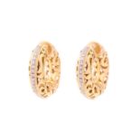 A pair of hoop earrings set with diamonds, each consists of a hinged hollow doughnut / torus with