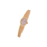 An Omega lady's wristwatch, with a hand-wound Swiss-made movement with a yellow metal oval case,