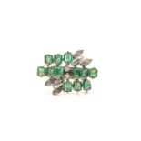 An emerald and diamond dress ring, with twelve rectangular step-cut emeralds, claw set on an