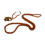 An amber bead necklace and matching bracelet, the necklace comprises graduating amber beads from