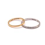 An 18ct gold ring and a platinum ring, the gold ring has a plain court band, stamped 'FIDELITY'