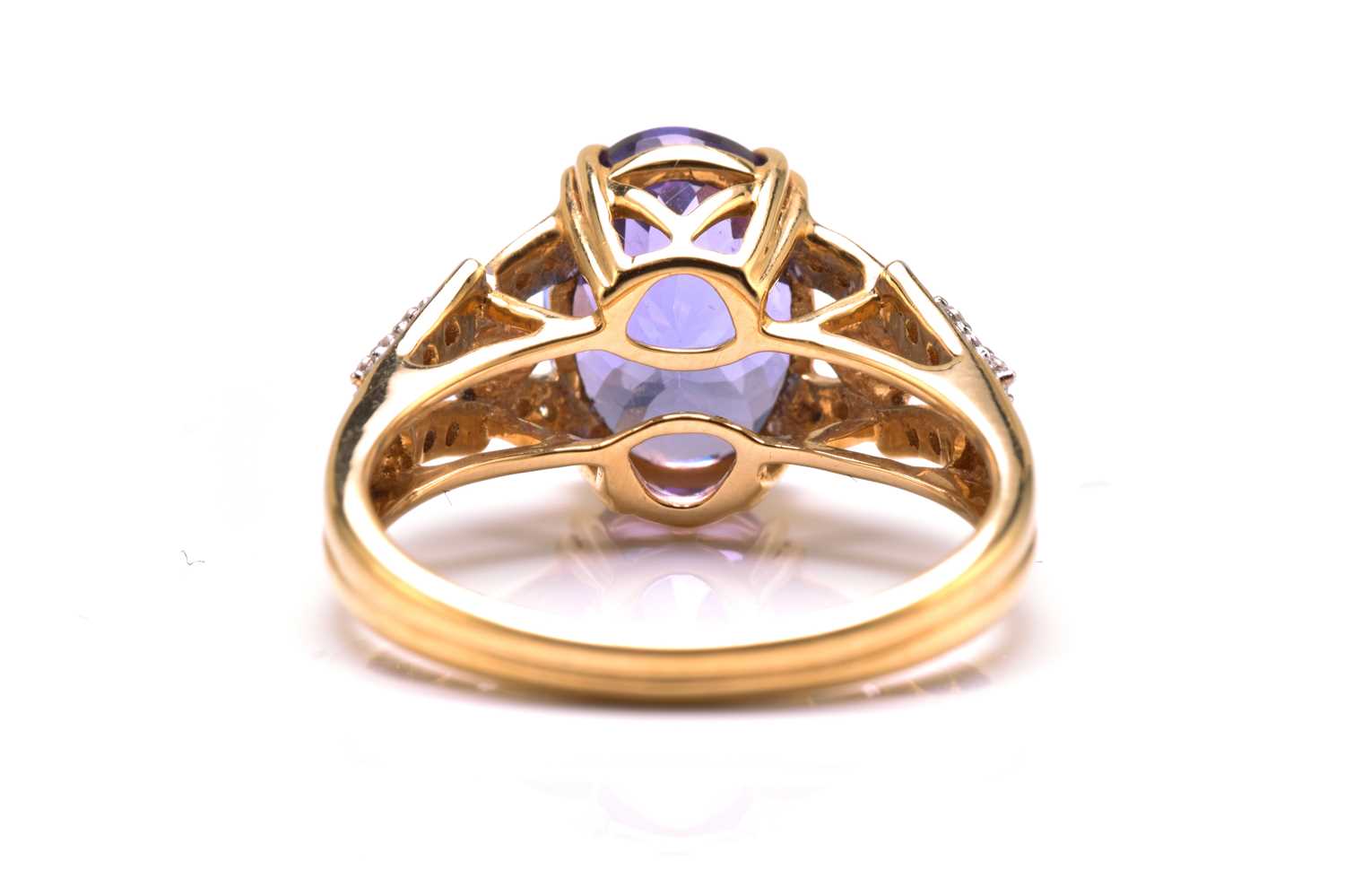 An 18ct bi-coloured gold diamond and tanzanite dress ring, featuring an oval fancy cut tanzanite - Image 3 of 4