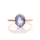 A sapphire ring, with an oval sapphire in pale blue colour, approximately measuring 10.5 x 8.0 mm,