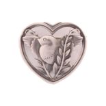 Georg Jensen - a heart-shaped brooch, depicting a flying dove with olive branches, fitted with