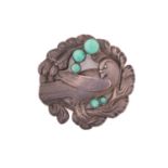 Georg Jensen - An embossed silver brooch, depicting dove in wreath with amazonite cabochon