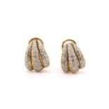 A pair of diamond clip-on earrings, each fully pavé set with brilliant diamonds, on a clam motif