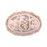 Georg Jensen - a silver oval brooch, depicting stylised grape-vine cut-outs in the centre, fitted