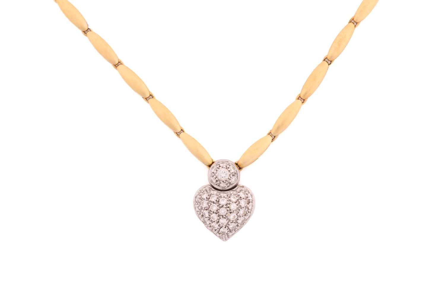 An 18ct bi-coloured gold necklace with a heart pendant, which has round brilliant diamonds pavé