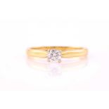 A diamond solitaire ring, consisting of a white round brilliant diamond approximately weighs 0.29ct,