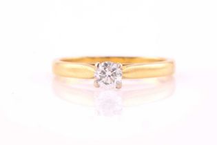 A diamond solitaire ring, consisting of a white round brilliant diamond approximately weighs 0.29ct,
