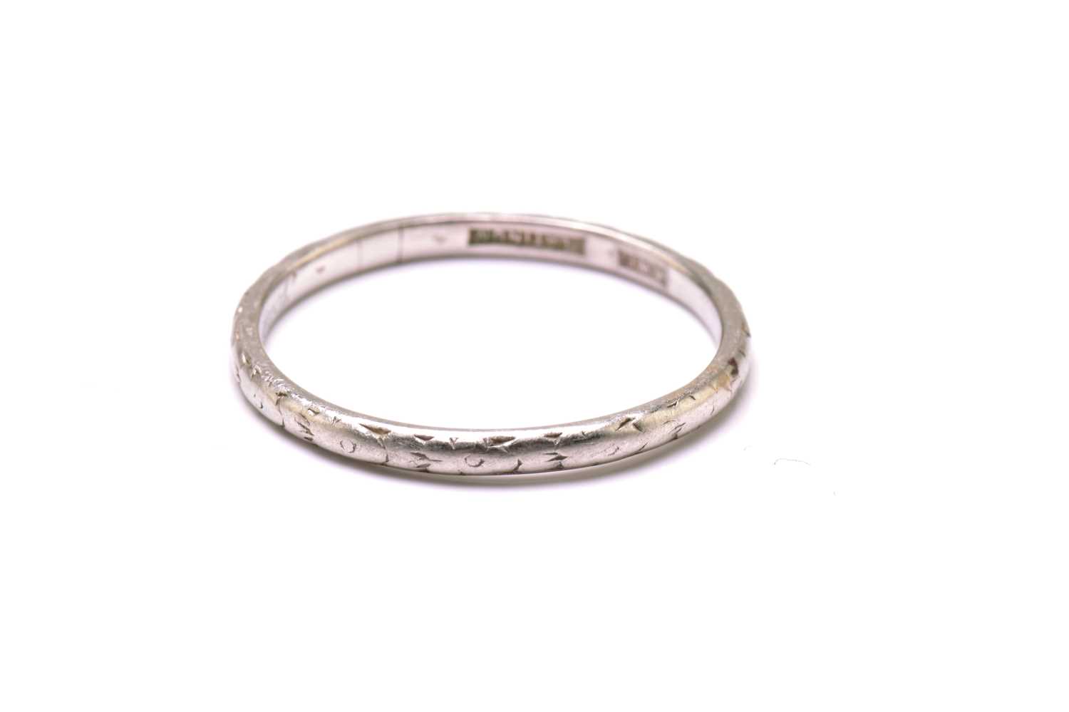 An 18ct gold ring and a platinum ring, the gold ring has a plain court band, stamped 'FIDELITY' - Image 4 of 5