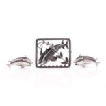 Georg Jensen - a lot with 'double dolphin' brooch and a pair of matching cufflinks, the brooch