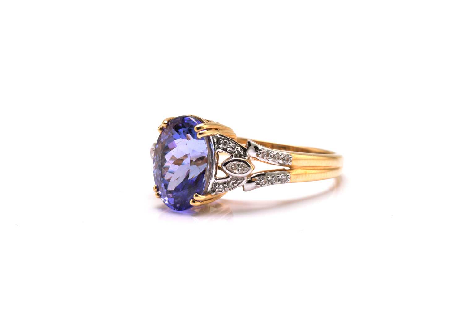 An 18ct bi-coloured gold diamond and tanzanite dress ring, featuring an oval fancy cut tanzanite - Image 2 of 4