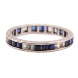 An eternity ring with sapphires, consisting of square step-cut sapphires and white stones channel