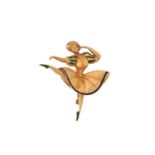 An enamel ballerina brooch, featuring a figurine of a dancing ballerina in a textured dress with