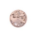 Georg Jensen - An embossed brooch, depicting a bird eating berries, with hinged pin stem and