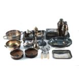 A collection of silver-plated wares including, entre dishes, cocktail shakers, hinged cover boxes