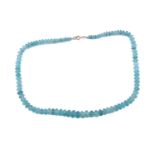 A faceted aquamarine bead necklace, comprising a string of ninety-one aquamarine beads in light blue