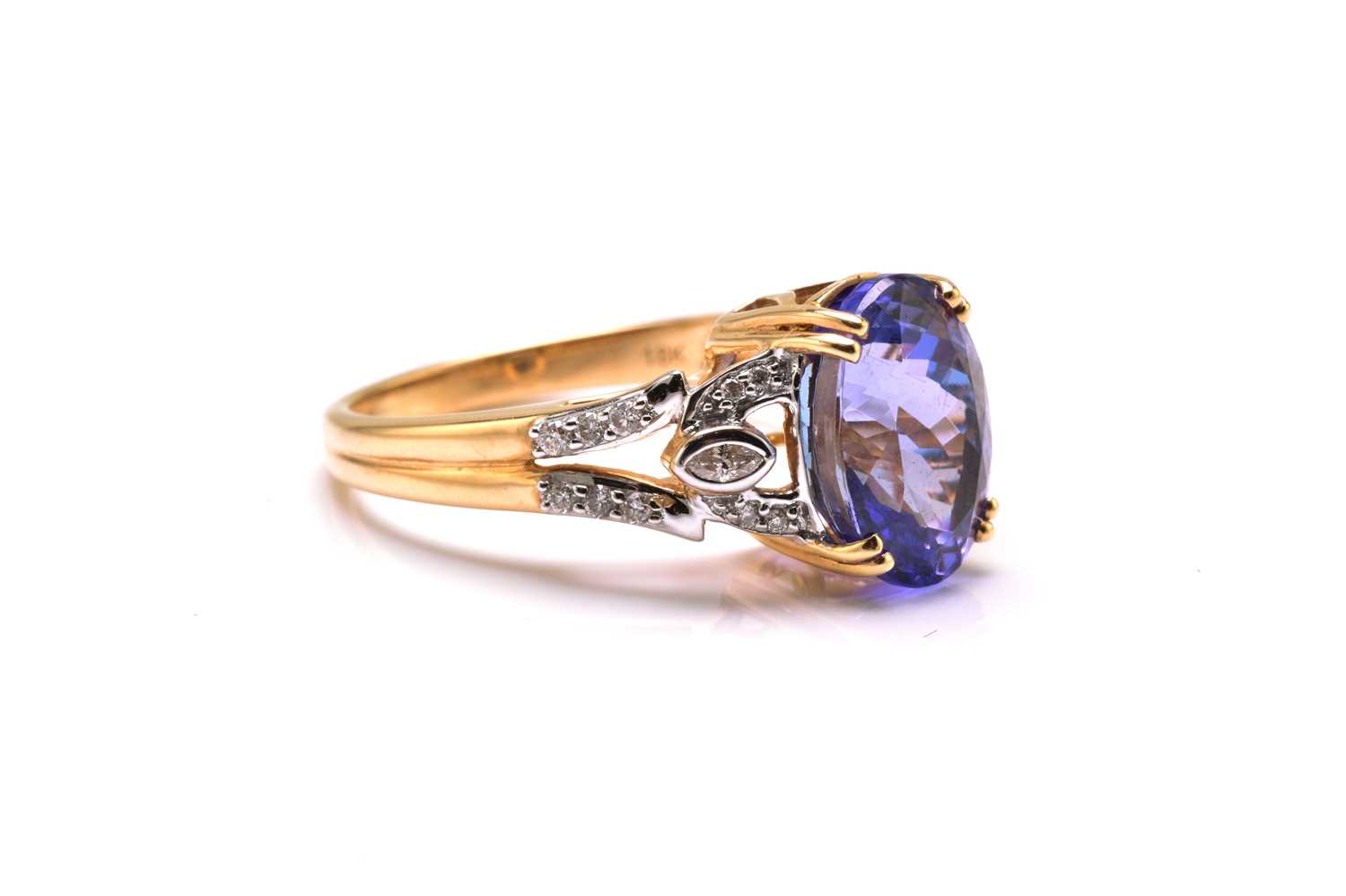 An 18ct bi-coloured gold diamond and tanzanite dress ring, featuring an oval fancy cut tanzanite - Image 4 of 4