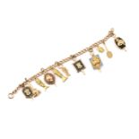 A gold-filled bracelet with assorted college fraternity charms, some of the charms are marked