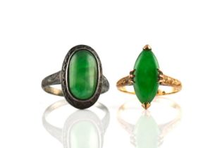 Two jade rings, one comprises a marquise-shaped chrome green jadeite cabochon claw set on a yellow
