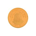 A 1976 UAE 5th National Day 500 dirham 22ct gold coin, features a relief portrait head of Sheikh