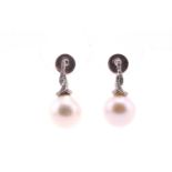 A pair of South-Sea pearl and diamond earrings, the slightly off-round pearls with diamond set