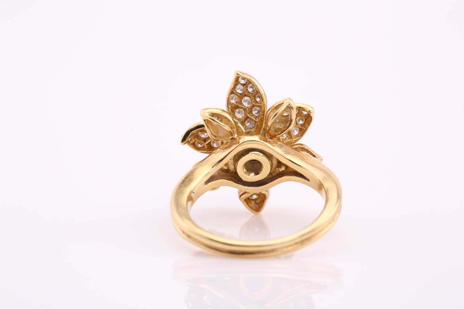 An 18ct gold sapphire and diamond flower ring, comprises an oval sapphire cabochon with a high dome, - Image 3 of 4