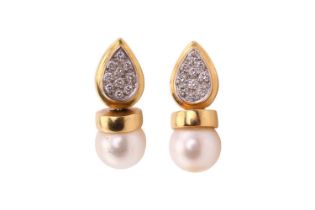 A pair of pearl and diamond earrings, each consisting of an 8.5 mm cream coloured pearl with pink