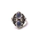 Georg Jensen - A moonstone ring, comprises two oval moonstone cabochons collet set on silver mount