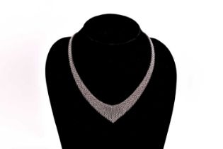 Tiffany & Co. - A silver mesh bib necklace with tie ends, designed by Elsa Peretti, signed by T&