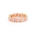 A diamond eternity ring, comprises fourteen round brilliant diamonds with an estimated total