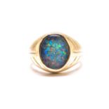 An opal triplet ring, comprises an oval precious opal triplet with dark body colour, with abundant