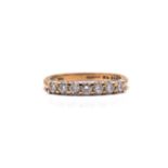 A 9ct gold seven-stone diamond ring, consisting of seven brilliant diamonds with an estimated