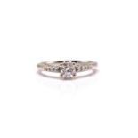 An 18ct white gold diamond solitaire ring, comprises a brilliant diamond with an estimated weight of