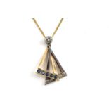 A diamond and sapphire pendant on chain, comprising a geometrical motif with two interlocking