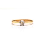 An 18ct yellow gold and diamond solitaire ring, comprises an old mine-cut diamond of approximately