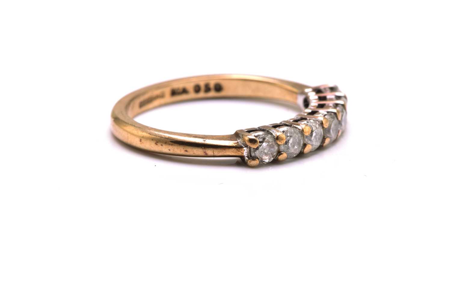 A 9ct gold seven-stone diamond ring, consisting of seven brilliant diamonds with an estimated - Image 2 of 4