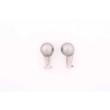 A pair of Tahitian pearl and diamond ear clips, each consisting of a grey Tahitian pearl