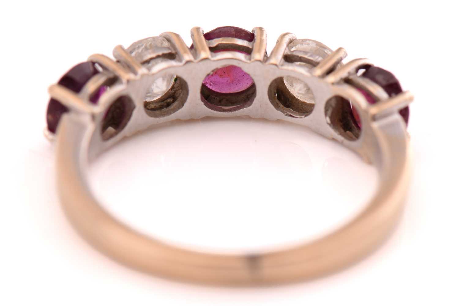 A ruby and diamond five-stones ring, consisting of two round brilliant diamonds with an estimated - Image 3 of 3