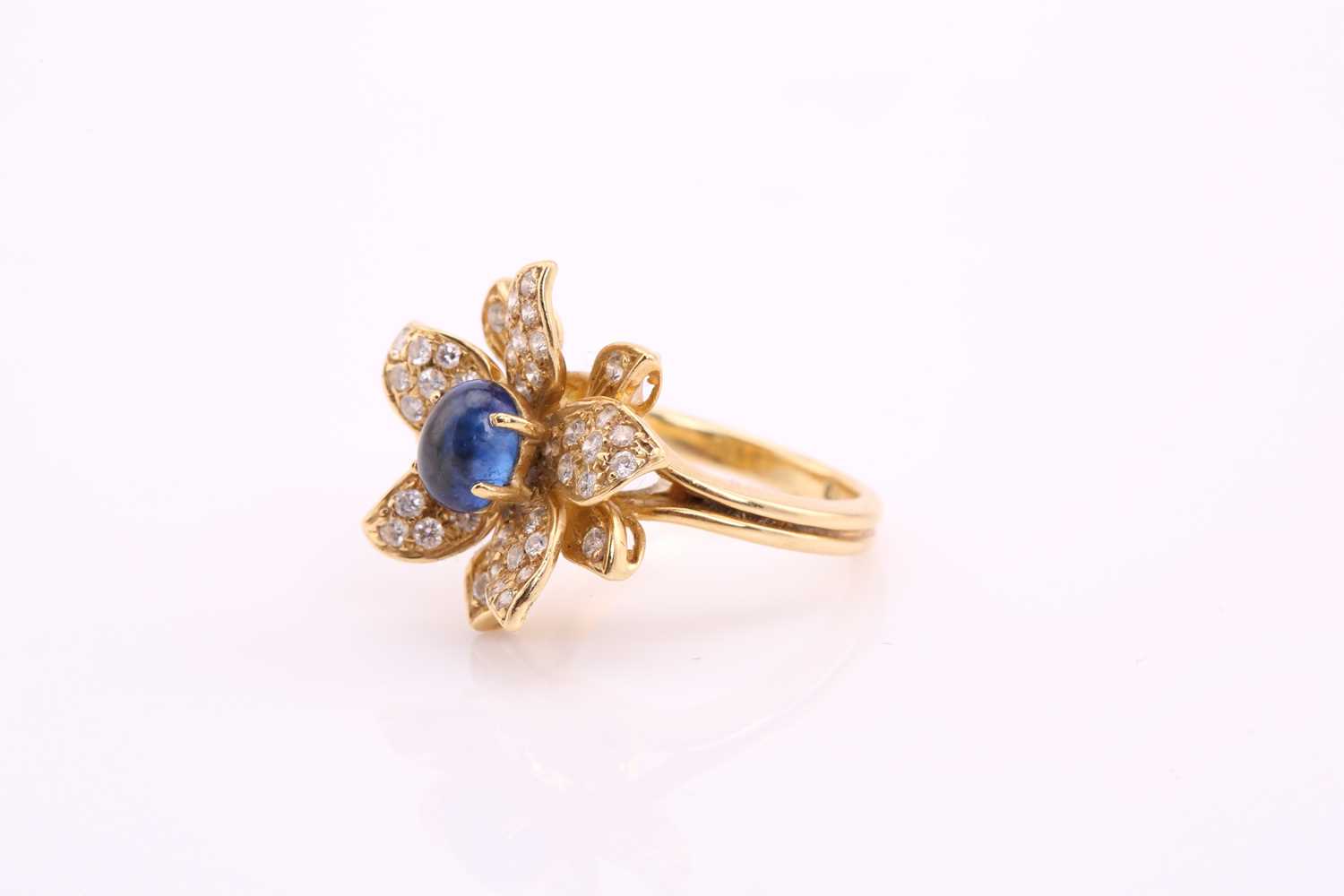 An 18ct gold sapphire and diamond flower ring, comprises an oval sapphire cabochon with a high dome, - Image 4 of 4