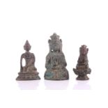 Three small Chinese bronze figures, comprising two of Avalokitesvara, seated with hands in mudra,