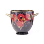 A large and unusual William Moorcroft planter, in the Pomegranate pattern, with twin handles and