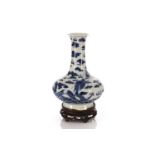 A Chinese blue & white dragon vase, Qing, 19th/20th century, with flaring rim above a long neck
