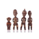 Four carved animal bone figural amulets, Cameroon, a small Janus amulet, pierced through the neck,