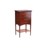 Edwardian mahogany four-drawer pedestal music cabinet with fall fronts to each drawer. On slender