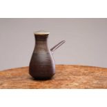 Lucie Rie (1902-1995), a manganese glaze coffee pot, with vertical incised decoration to the collar,